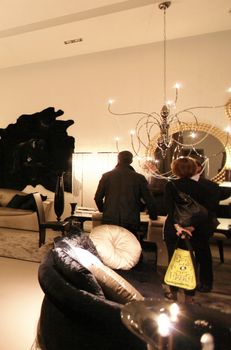 People visit interiors design stands and home architecture solutions at 2011 Salone del Mobile, international furnishing accessories exhibition in Milan, Italy.