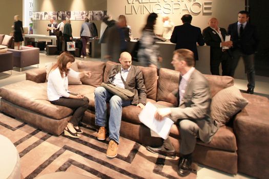 People visit interiors design stands and home architecture solutions at 2011 Salone del Mobile, international furnishing accessories exhibition in Milan, Italy.