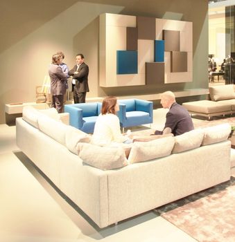 People visit interiors design stands and home architecture solutions at 2011 Salone del Mobile, international furnishing accessories exhibition in Milan, Italy.