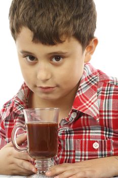young boy  drinking hot chocolate