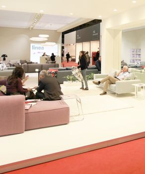 People visit interiors design stands and home architecture solutions at 2011 Salone del Mobile, international furnishing accessories exhibition in Milan, Italy.