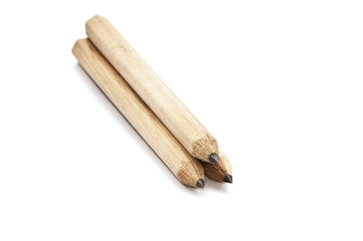 Three pencils for drawing on a white background