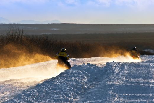 Man on snowmobile in the bighorn mountains, wyoming