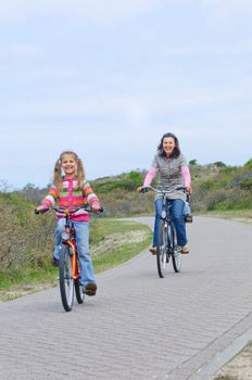 Mother with children having a weekend excursion on their bikes