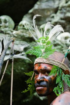 INDONESIA, NEW GUINEA, SECTOR SENGGI - 2 FEBRUARY 2009: The warrior of a Papuan tribe of Yafi in traditional clothes, ornaments and coloring. New Guinea Island, Indonesia. February 2, 2009. 