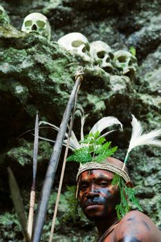 INDONESIA, NEW GUINEA, SECTOR SENGGI - 2 FEBRUARY 2009: The warrior of a Papuan tribe of Yafi in traditional clothes, ornaments and coloring. New Guinea Island, Indonesia. February 2, 2009. 