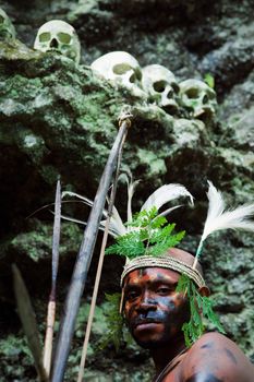 INDONESIA, NEW GUINEA, SECTOR SENGGI - 2 FEBRUARY 2009: The warrior of a Papuan tribe of Yafi in traditional clothes, ornaments and coloring. New Guinea Island, Indonesia. February 2, 2009. 