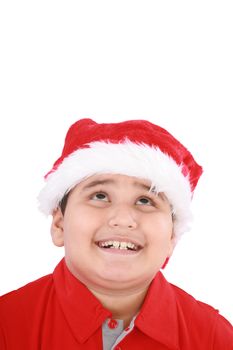 Head shot of young beauty Santa boy looking up to copy space and smiling