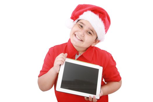 Adorable child with Santa hat offering a tablet isolated on white background