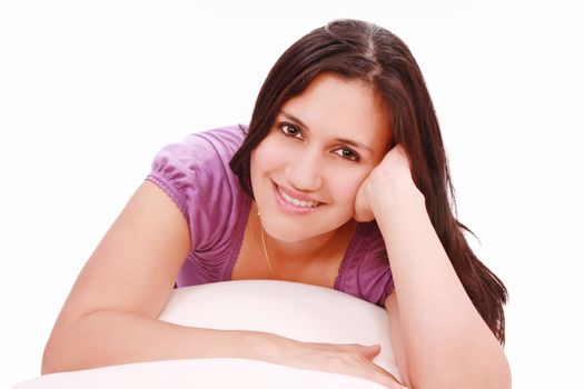 Portrait of cute young girl laying down in her bed