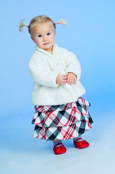 cute baby girl in black pink and white stylish outfit in studio