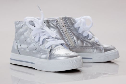 fashion series: children's silver running shoes over white