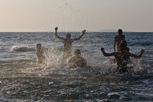 leisure series: sea and silhouette of splash with water people