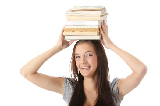 Teenage girl struggling with stack of books isolated