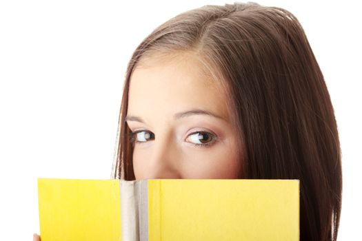 Young caucasian woman reading a book isolated on white background