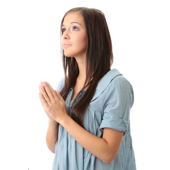 Closeup portrait of a young caucasian woman praying isolated on white background