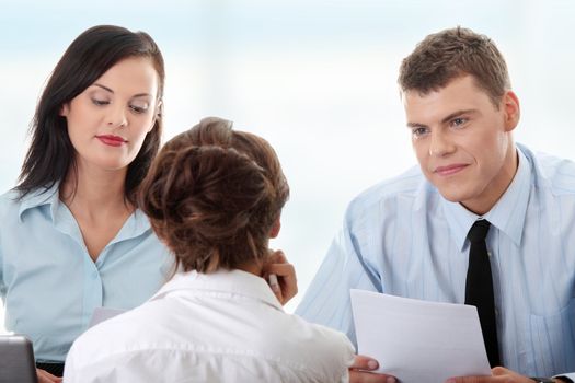 Business coaching concept. Young woman being interviewed for a job.