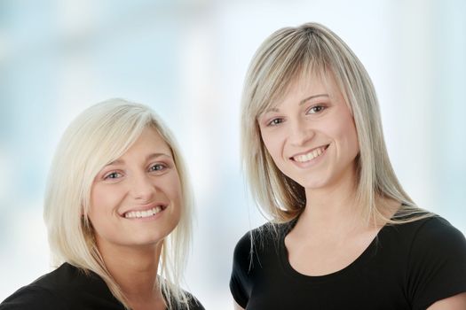 Portrait of two casual caucasian women (students or business people)