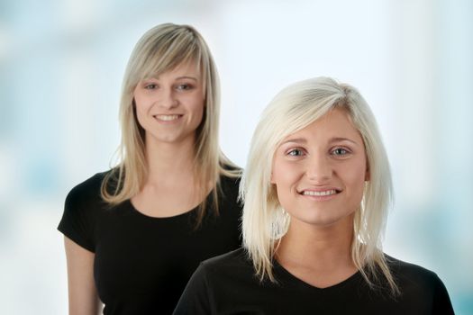 Happy young women friends smiling.