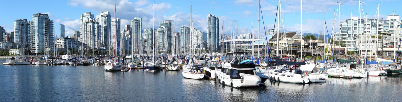 A panoramic view of south Vancouver BC skyline & sailboats in False creek, Canada.