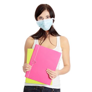 Caucasian student woman with mask on her face. She is defending her self from viruses. Isolated on white