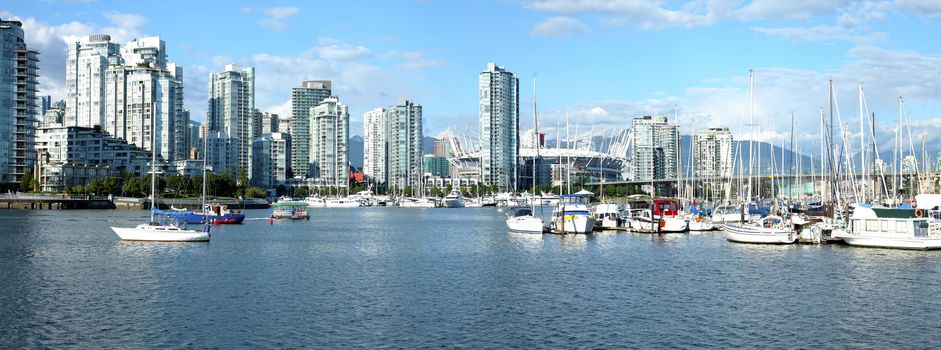 A panoramic view of False creek & Vancouver BC skyscrapers.