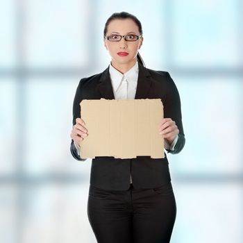 Unemployed businesswoman with empty cardboard sign