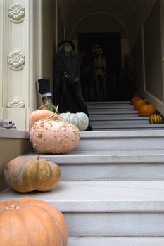 Halloween Witch Decoration and Pumpkins in Front of House from the Street