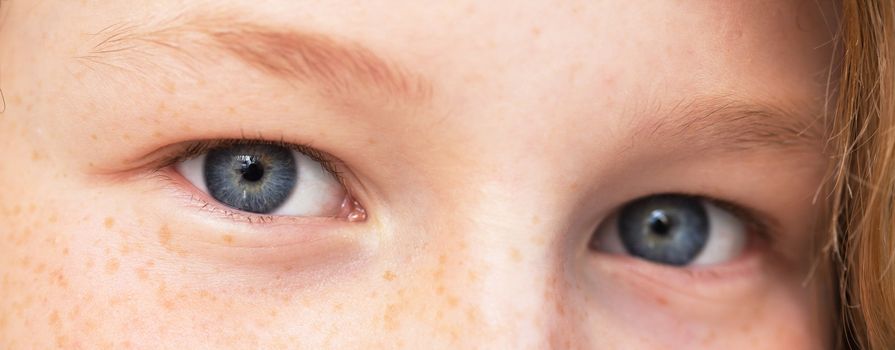 Closeup view of teenager girl's eyes, shallow DOF (only one eye in focus)