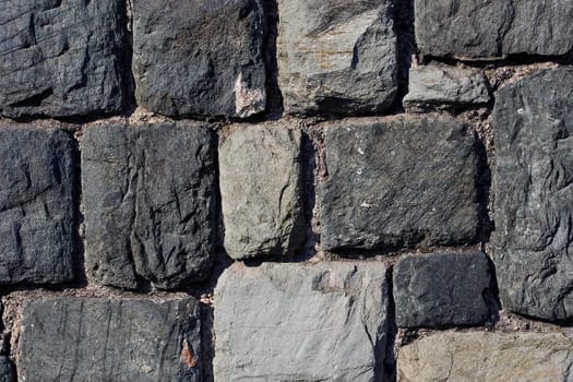 Aged stone wall close up