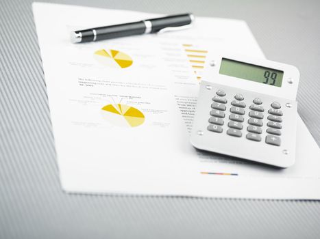 Market Analyze - pen and calculator on papers