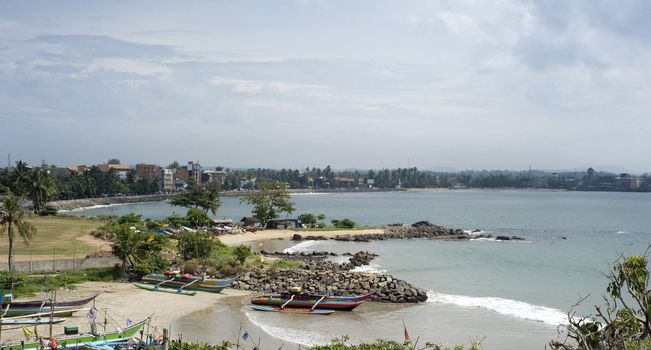 Skyline of Galle with beautiful beach and fishing boats. Sri Lanka