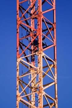 Part of the construction crane with blue sky as background