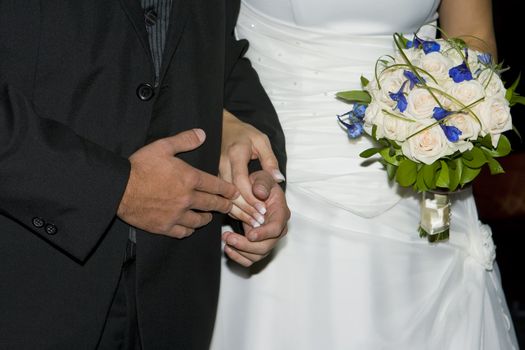 Bridal couple holding hands at the ceremony