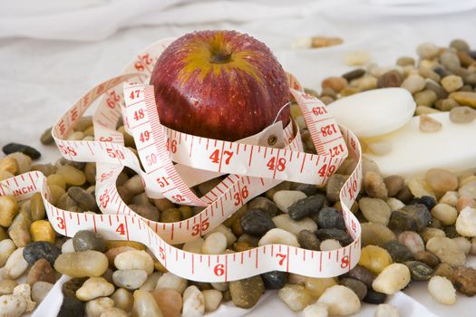 Healthy eating represented by apple and tape measure