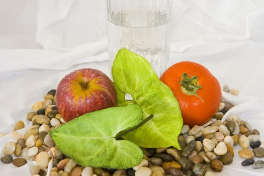 Healthy eating, fruit and vegetables with glass of water.