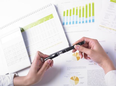 Analyzing Business Data - pen and numbers on paper