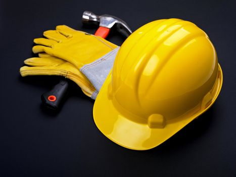 HardHat Hammer And Leather Gloves on black