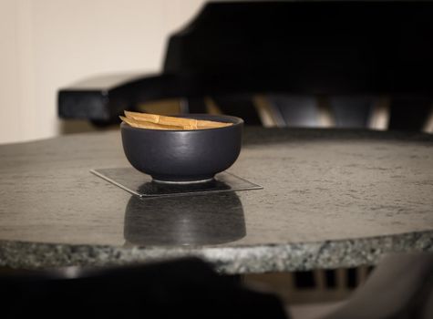 Coffe shop table with price list under a sugar bowl