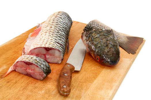 Fresh fish is split, prepared for cooking, isolated on a white background.
