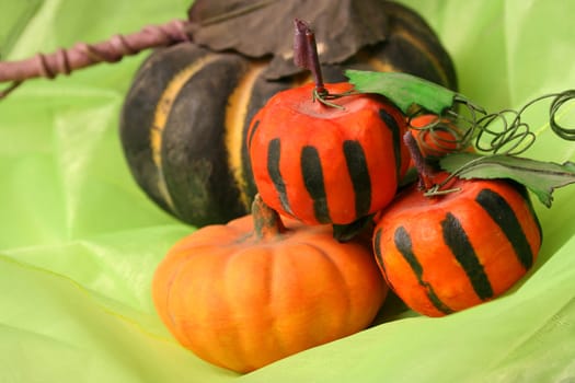 Old halloween pumpkins on a green background