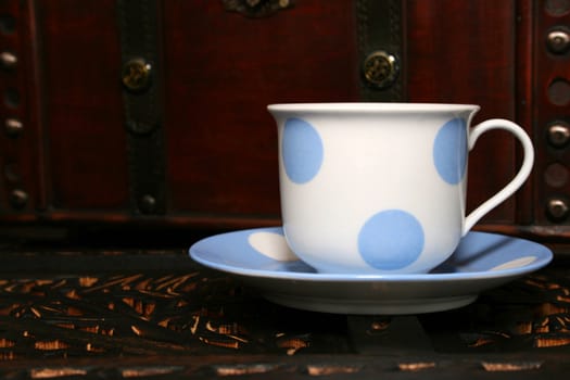 Blue and white polka dot tea cup and saucer