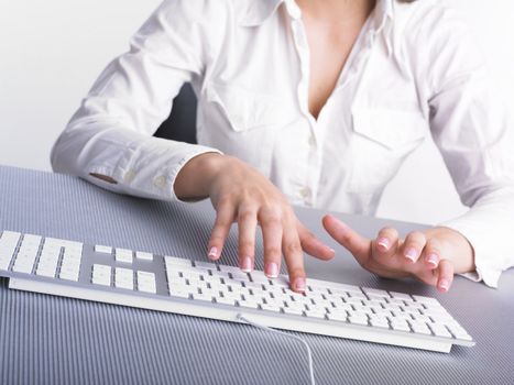 Business Secretary Typing on Computer Keyboard