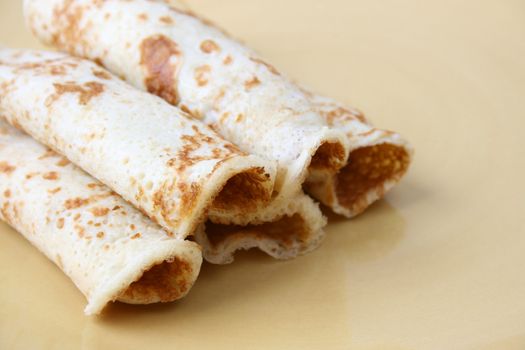 Close up of pancakes on a yellow plate