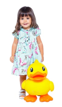 Clouse-up portrait pretty little girl with duck. Isolated. In studio