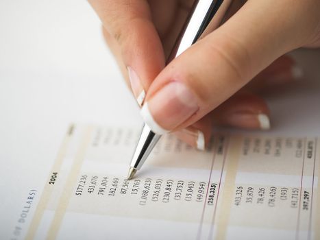 Market Analyze - pen and calculator on papers