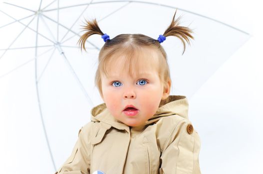 Portrait Very Cute baby Girl with umbrella in studio