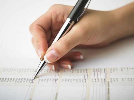 Market Analyze - pen and calculator on papers
