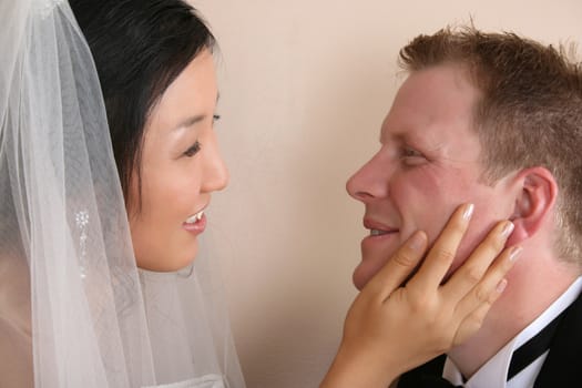 Bride and groom looking at one another