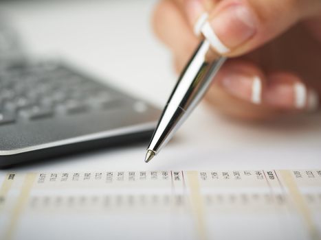 Market Analyze - pen and calculator on papers